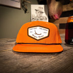 The only thing better than a blaze orange grandpa hat is pairing with buffalo plaid