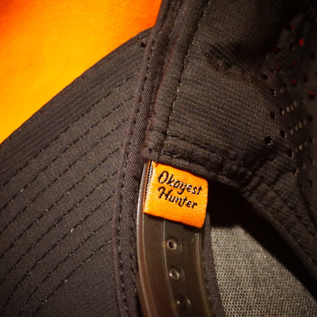 Black cap with 'Oxygent Hunter' logo on an orange background